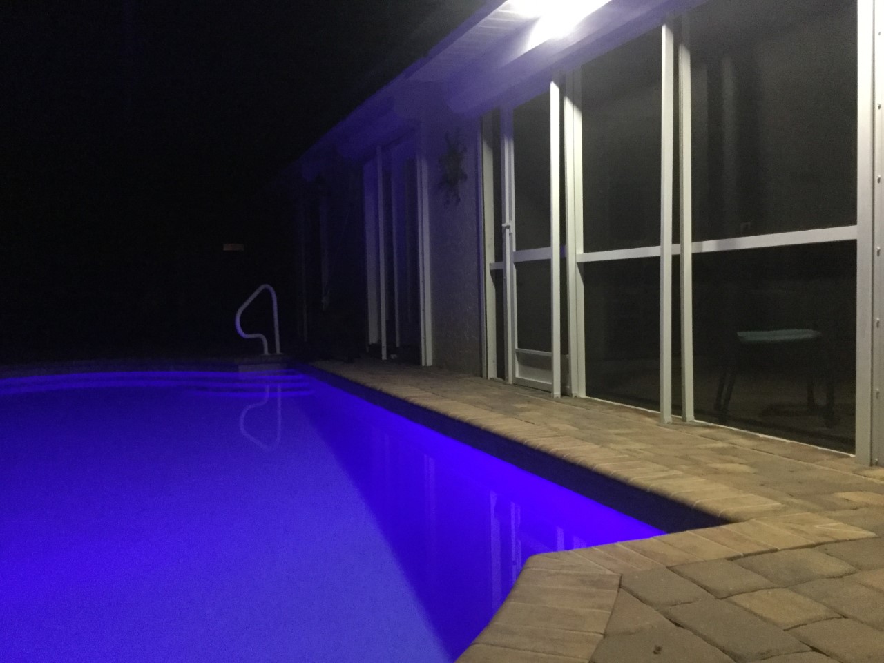 The Pool Deck Is Lighted For A Late Night Dip Or Some Evening Entertaining